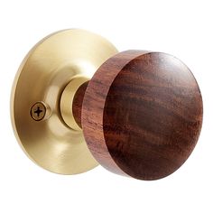 a wooden door knob with a brass finish