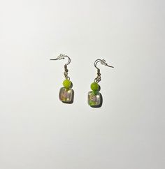 Drop Length: 3cm Earrings made with green stone and multicolored glass beads Hooks and jump rings made of gold plated metal. CARE INSTRUCTIONS: -Keep out of water! -Store/Keep in a dry and cool place. -Handle carefully. Message me for any questions! Everyday Green Glass Jewelry, Green Dangle Earrings In Recycled Glass, Green Glass Dangle Earrings, Green Recycled Glass Earrings For Beach, Green 14k Gold-filled Dangle Earrings, Nature Aesthetic, Green Stone, Gold Details, Glass Earrings