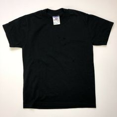 Kid's JERZEES Heavy Weight Blend Black Short Sleeve T-Shirt - Crew Neck. Size Child's Small - 6-8.Unisex. This tee can be worn by a boy or a girl. No embellishments or design. Solid, plain black basic t-shirt. Fabric content: 50% cotton, 50% polyester.This item is pre-owned. Excellent condition. Outgrown before it could really be used.Worn just a few times. No marks, wear, stains or scents. Carefully stored. From a smoke free and pet free home. Tee measurements: armpit-to-armpit:  14.5" shoulder Graphic Tshirt Design, Plain Tshirt, Basic T Shirt, Plain Black, Black Kids, A Boy, Black Shorts, Sleeve Cotton, Heavy Weight