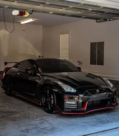 a black sports car parked in a garage