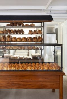 a display case filled with lots of baked goods