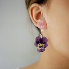 Aren't flowers great? With my handmade jewellery, you can wear your garden or your favourite flower! Every single flower is natural, and no pair of earrings will ever look the same. What you get is completely unique and one of a kind.  Everything in my shop is handmade using real pressed flowers preserved in resin, and all wires/studs are either 925 sterling silver, real gold plated brass or gold plated sterling silver.  Most jewellery is made to order, so if you would want any adjustments made, or have any questions at all, please get in touch. Shipping: Most orders will be shipped out within two working days, look out for a little pink box with your name on it! If ordered as a gift, I will add a handwritten note with your gift message on it. Free delivery within the UK. Free delivery on Purple Flower Nature-inspired Jewelry, Nature-inspired Purple Flower Jewelry, Purple Nature-inspired Flower Jewelry, Purple Pressed Flower Drop Earrings, Handmade Purple Flower-shaped Jewelry, Purple Flower-shaped Jewelry With Handmade Flowers, Purple Flower Jewelry With Handmade Details, Purple Flower Jewelry With Handmade Flowers, Nature-inspired Flower Jewelry With Ear Wire