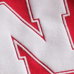 Display your Nebraska Huskers pride by wearing this Spirit Jersey V-neck T-shirt around town. Brand: Spirit Jersey Loose Fit: Oversized cut. Designed with little to no structure in shoulders, chest and waist. Machine wash, tumble dry low Made in the USA Material: 100% Cotton Officially licensed Puff print graphic Short sleeve Sizing Tip: Product runs large. We recommend ordering one size smaller than you normally wear. V-neck Red Oversized Sporty T-shirt, Oversized Red Sporty T-shirt, University Red Cotton Sweatshirt With Letter Print, Red Sporty Sweatshirt With Letter Embroidery, Oversized Red Collegiate Top, Red Sweatshirt With Letter Embroidery For Streetwear, Red Letter Embroidery Sweatshirt For Streetwear, Nebraska Shirts, Nebraska Huskers