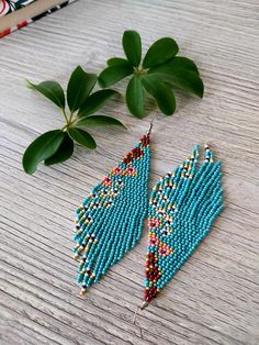 Turquoise beaded fringe earrings seed bead earrings dangle boho earrings chandelier earrings native beaded earrings colorful beaded earrings For same model smaller size ;  https://www.etsy.com/listing/1189984832 For other color of the same model; https://www.etsy.com/listing/1160713718 https://www.etsy.com/listing/1185696962 https://www.etsy.com/listing/1201751487 ♥𝑇ℎ𝑒 𝑝𝑎𝑡𝑡𝑒𝑟𝑛 𝑜𝑓 𝑡ℎ𝑖𝑠 𝑒𝑎𝑟𝑟𝑖𝑛𝑔 𝑖𝑠 𝑖𝑛𝑠𝑝𝑖𝑟𝑒𝑑 𝑏𝑦 𝑓𝑖𝑒𝑙𝑑𝑠 𝑓𝑢𝑙𝑙 𝑜𝑓 𝑓𝑙𝑜𝑤𝑒𝑟𝑠 𝑖𝑛 𝑛𝑎𝑡𝑢? Turquoise Seed Bead Earrings, Turquoise Beaded Tassel Earrings For Summer, Summer Turquoise Beaded Tassel Earrings, Turquoise Beaded Fringe Tassel Earrings For Festival, Turquoise Tassel Earrings With Colorful Beads For Festival, Bohemian Turquoise Tassel Earrings With Colorful Beads, Turquoise Beaded Fringe Earrings For Summer, Bohemian Turquoise Drop Beaded Earrings, Bohemian Turquoise Beaded Drop Earrings