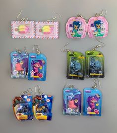 there are six keychains that have different characters on them, and one is for sale