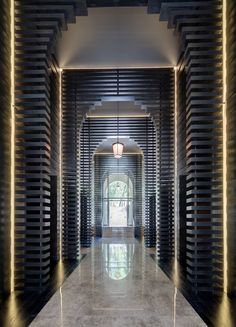 the hallway is lined with wine bottles and lights