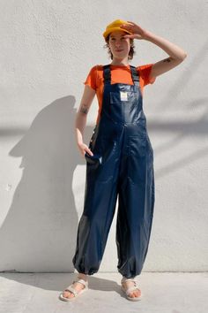 Weather resistant waders with elastic hem and adjustable straps with side and back pockets and one large front pocket.    details:    - 100% polyurethane    lola is 5'7" bust: 34" waist: 26" hips: 35" wearing a size 2 Outdoor Bib Front Overalls With Pockets, Utility Overalls With Belt Loops, Utility Style Overalls With Belt Loops, Utility Bib Front Bottoms With Pockets, Utility Style Bottoms With Adjustable Straps, Utility Style Bib Front Bottoms For Workwear, Utility Bib Front Bottoms For Workwear, Utility Bib Front Bottoms For Fall, Blue Bib Front Utility Bottoms