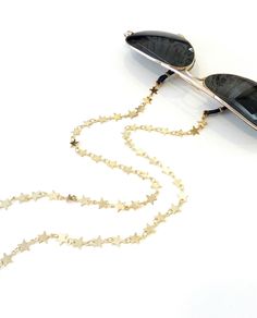 Sunglasses star chain, Stars eyeglass necklace, Gold glasses chain, Accessories for sunglasses, Eyeglasses necklace, Reading glasses chain Beautiful fashion trend sunglasses gold plated chain over brass Total length is 70cm / 27.5 inches. Beautifully packaged and ready for gift giving.  JEWELRY CARE: Please take care of your jewelry do not wear in the shower, swimming pool, or to bed.  Keep away from harsh chemicals and cleaners. It is always best to put on your jewelry on after applying lotions Trendy Star Charm Jewelry For Summer, Trendy Summer Jewelry With Star Charm, Trendy Summer Star-shaped Jewelry, Adjustable Star Charm Necklace For Summer, Trendy Party Glasses Chains With Adjustable Chain, Trendy Metal Glasses Chains For Summer, Trendy Adjustable Party Glasses Chains, Trendy Silver Glasses Chains For Summer, Metal Glasses Chains For Summer Parties