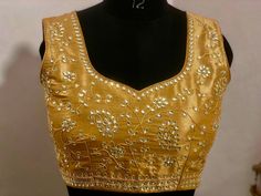 Hand made Exclusive bridal collection  Work kardana n zardosi Net hands Stone studded great work  hand work completely , awesome skills applied work ! Any color can be done ! Gold Silver come up with any color with your blouse measurements we can make it for you! contact seller for time and dispatch Gold Embellished Semi-stitched Blouse Piece, Gold Embellished Blouse Piece For Designer Wear, Anarkali Gold Blouse Piece With Mirror Work, Gold Blouse Piece With Mirror Work, Designer Gold Embellished Blouse, Traditional Gold Embellished Tops, Embellished Chanderi Blouse With Traditional Drape, Bollywood Style Embellished Chanderi Blouse, Gold Bollywood Traditional Wear With Handwork