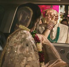 the bride is getting ready to get into her car