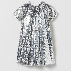 Sequin Dress Round Neck Short Sleeve Dress. Back Zip Closure . Color: Silver Outer Shell 100% Polyester Lining 100% Polyester New With Short Sleeve Holiday Dresses For Dress-up, White Short Sleeve Holiday Dress, White Short Sleeve Dress For Holidays, Spring Festive Short Sleeve Sequin Dress, Sequin Short Sleeve Dress For Dress-up, Spring Festive Sequin Dress With Short Sleeves, Fitted Sequin Short Sleeve Dress For Dress-up, Festive Holiday Dresses With Short Sleeves, Zara Spring Holiday Dresses