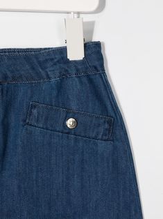 Blue cotton Keana denim skirt from KNOT featuring front button and zip fastening, front flap pockets and thigh-length. | Knot Keana denim skirt Curator Style, Flap Pocket, Denim Skirt, Knot, Mini Skirts, Skirt, Pants, Blue, Trousers