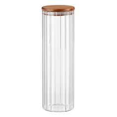 a clear glass vase with wooden lid