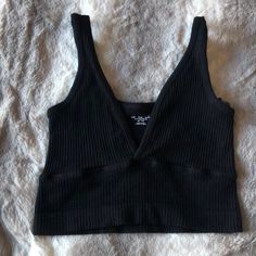 Super Low Tight Stretch Crop Top Never Worn Black Seamless V-neck Top, Black Casual V-neck Crop Top, Casual Black V-neck Crop Top, Urban Outfitters Sleeveless Black Crop Top, Casual Black V-neck Tank Top, Fitted Black Crop Top By Urban Outfitters, Black Cropped Tops By Urban Outfitters, Black Cropped Top From Urban Outfitters, Fitted Black Tops From Urban Outfitters