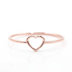 Super cute, this dainty ring has an open heart shaped cut out and is perfect for stacking or on its own.  Available in 14k yellow, rose, or white.  Also avaialable in platinum. Stackable Rose Gold Heart Ring Fine Jewelry, Minimalist 14k Rose Gold Heart Ring, Rose Gold Stackable Heart Ring In Fine Jewelry Style, Delicate Rose Gold Heart Ring, Minimalist Rose Gold Heart Ring In Sterling Silver, Minimalist Rose Gold Sterling Silver Heart Ring, Rose Gold Promise Ring With Open Heart Shape, Minimalist Rose Gold Open Heart Ring, Minimalist Open Heart Promise Ring