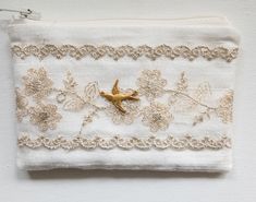 Handmade pouch, Made with silk fabric, lace and cotton lining. Approx. 4" x 3". Zipper closure. Embellished with a small, brass bird charm. Handmade Pouch, Rosary Jewelry, Brass Bird, Bird Charm, Keepsake Jewelry, Coin Purses, Purse Pouch, Keepsake Gift, Decorative Pillow Covers