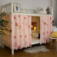 a child's bed with pink curtains on it