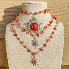 "Silver Wire Wrapped Carnelian Crystal Choker/Gemstone Necklace/Carnelian Crystal Hippie Necklace/Boho Crystal Choker/Sun Charm Necklace/Gift - Choker style crystal necklace with Carnelian Chip Crystal Beads, one of 3 charms available - Length is 15\", 16\", 17\", 18\" or 19\"  - Materials: Silver plated copper wire, natural Carnelian crystals and, brass and stone charms Check other styles in my shop: https://www.etsy.com/listing/1442563528/green-aventurine-wire-wrapped-gold?click_key=4cabd23364 Dragon Fire, Opalite Crystal, Sun Charm, Boho Crystal, Carnelian Crystal, Amethyst Gold, Wire Wrapping Crystals, Purple Agate, Hippie Necklace