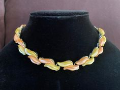 "Designer: Unsigned This pretty necklace has a waves of brown peach and yellow with a pearl or moonglow coating on a silver toned setting. There is wear to the chain and the back of several links but the front is in good vintage condition. The chain is a darkened bronze color. Necklace measures 12 1/2\" to 16 1/2\"X 1/2\" wide Please be sure to view all pictures and consider photos as part of the description. Do not forget to use the \"ZOOM\" feature when viewing pictures. View my entire shop at https://www.etsy.com/shop/AlicenEstherVintage?ref=shop_sugg Thanks for looking!" Retro Brown Necklace For Gift, Retro Orange Necklace Gift, Yellow Pearl, Pretty Necklace, Color Necklace, Coral And Gold, Moon Glow, Pretty Necklaces, Beaded Brooch