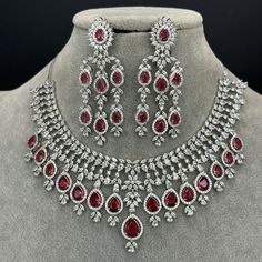 Ruby CZ diamond bridal necklace, American Diamond wedding necklace, Cz jewelry, Indian, Pakistani, and Punjabi wedding jewelry Regular Size And Adjustable with rhodium finish Ships from California, USA Delivery in 2-5 business days in the USA. Other colors can be found here https://www.etsy.com/listing/1423097794/sapphire-cz-diamond-bridal-necklace?ref=listings_manager_grid https://www.etsy.com/listing/1423095388/emerald-cz-diamond-bridal-necklace?ref=listings_manager_grid Color, shades, and texture displayed may slightly vary from the actual product due to digital image limitations. We request you consider these minor variations. Please expect the possibility of some slight imperfections when buying handmade jewelry. Please let me know if you have any questions. Arrives in a gift box. Tha Red Bridal Necklace With Sparkling Stones For Wedding, Fine Red Necklace For Wedding, Red Fine Jewelry Necklace For Wedding, Red Diamond Necklace For Wedding, Fine Jewelry Red Necklace For Wedding, Dazzling Red Bridal Necklace For Wedding, Fine Jewelry Red Diamond Necklace For Weddings, Red Cubic Zirconia Diamond Necklace For Wedding, Red Cubic Zirconia Necklace For Wedding