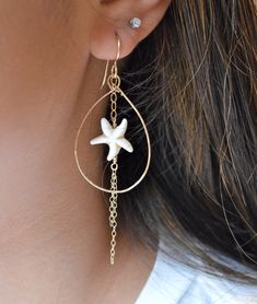 "These adorable starfish bead earrings are made from natural colored magnesite stone. They have delicate strands of gold chains dangling from them within a gold filled hammered teardrop. Teardrop measures approximately 1.5\" in length." Bohemian Gold Starfish Jewelry, Beach Jewelry With Dangling Charms, Beach Dangle Beads Jewelry, Starfish Charm Dangle Jewelry, Beach Jewelry With Teardrop Dangling Beads, Teardrop Dangling Beads Jewelry For Beach, Summer Star-shaped Jewelry For Pierced Ears, Beach Teardrop Jewelry With Dangling Beads, Elegant Starfish Charm Drop Earrings