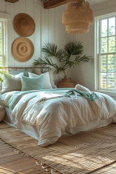 a large bed sitting in a bedroom next to two windows with wicker baskets hanging above it