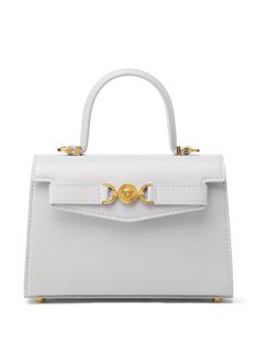 white calf leather Medusa plaque detail logo stamp to the rear gold-tone hardware foldover top with magnetic fastening adjustable detachable shoulder strap single flat top handle main compartment internal slip pocket internal logo stamp metal feet White Versace Bag, High-end Top Handle Bag With Cc Turnlock Closure, Elegant White Shoulder Bag With Cc Turnlock Closure, Luxury White Shoulder Bag With Cc Turnlock Closure, Classic White Bag With Cc Turnlock Closure, Evening Tote Shoulder Bag With Cc Turnlock Closure, Daily Use Top Handle Shoulder Bag With Cc Turnlock, Chic Tote Shoulder Bag With Cc Turnlock Closure, Leather Shoulder Bag With Cc Turnlock And Top Handle