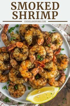 grilled shrimp on a plate with lemon wedges