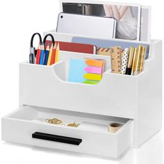 a white desk organizer with office supplies in it