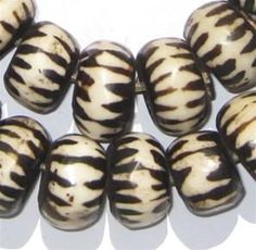 several black and white striped beads on a white background