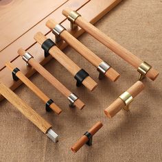 several wooden pegs and handles are arranged on the floor