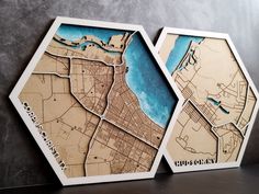 two wooden maps of the city of chicago, minnesota and michigan are shown in three hexagons