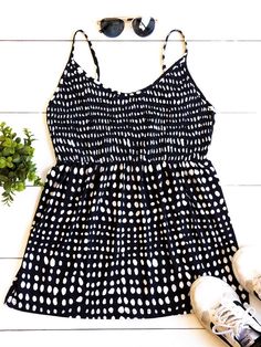 Cute, simple, and stylish... need we say more. The smocked top, beautiful pattern, and soft fabric make this tank stand out in a crowd. Note: Smocking is only on the front of the tank. The back is solid. Size Small 0-4 Medium 6-8 Large 10-12 XL 12-14 Casual Smocked Bodice Camisole Tank Top, Casual Camisole Tank Top With Smocked Bodice, Chic Polka Dot Tank Top For Summer, Smocked Back Cami Tank Top For Day Out, Casual Smocked Back Tank Top For Vacation, Cami Tank Top With Smocked Back For Day Out, Casual Tank Top With Smocked Back For Day Out, Casual Spaghetti Strap Top With Smocked Back, Casual Tops With Spaghetti Straps And Smocked Back