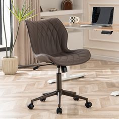 an office chair with wheels is in front of a desk