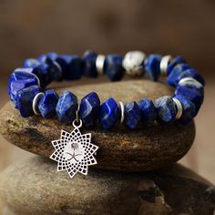 The Handmade Lapis Lazuli and Sunburst Charm Elastic Bracelet Looks Beautiful 🥰 You will get lots of compliments 💖. Treat yourself 🎁 or someone special. Lapis Lazuli brings out your inner priestess, heightens inner-vison and deepens wisdom. It benefits the Throat Chakra with communication and expression of creativity - feeling comfortable to express your feelings - Artistically Inspired. It benefits the Third Eye Chakra with higher intuition, perception, awareness and consciousness. It brings Crystal Bead Jewelry, Lapis Lazuli Crystal, Lapis Lazuli Bracelet, Lapis Lazuli Beads, Heart Drop Earrings, Stretchy Bracelets, Elastic Bracelet, Amethyst Stone, Gemstone Bracelets