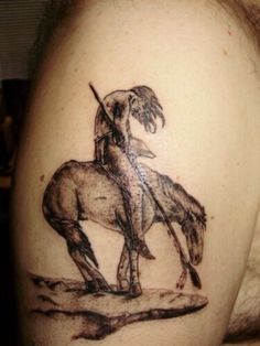 a man with a horse tattoo on his shoulder