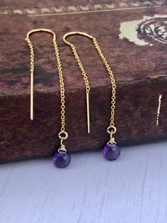 Amethyst Earrings, February Birthstone, Purple Threader Earrings in Gold or Silver, Purple Long Chain Earrings, Minimalist Amethyst Jewelry Amethyst teardrops suspended from 14k gold filled or sterling silver ear threaders. Gemstone: Amethyst Birthstone: February Stone Size: 5 mm Earring Length: 35mm Stone Shape: Teardrop Material: Choice of 14k Gold Filled or Sterling Silver Gift Wrapping Included in all orders Handmade in NYC We can customize these earrings in dozens of colors and gemstones. J Purple Amethyst Jewelry For Pierced Ears, Purple Amethyst Earrings For Pierced Ears, Everyday Purple Dangle Earrings, Minimalist Nickel-free Purple Jewelry, Gold Amethyst Crystal Earrings With Gemstone, Amethyst Briolette Earrings Gift, Gold Amethyst Gemstone Crystal Earrings, Gold Amethyst Crystal Earrings, Dainty Purple Earrings With Ear Wire