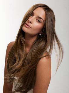 A dimensional medium brown with a short chestnut root smudge, neutral dark chocolate lowlights, and golden-brown highlights. faq what-lengths-do-you-offer how-do-i-choose-the-right-luxy-hair-set what-is-the-difference-between-classic-and-seamless-extensions can-i-dye-curl-and-straighten-my-hair-extensions how-do-i-care-for-my-extensions how-long-does-shipping-take-1 Dark Chocolate Lowlights, Brown Halo Hair, Neutral Brown Hair, Chocolate Lowlights, Brown Extensions, Golden Brown Highlights, Root Smudge, Brown Hair Extensions, Luxy Hair Extensions