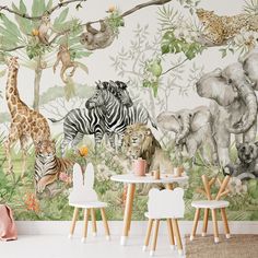 a children's room with an animal mural on the wall and toys in front