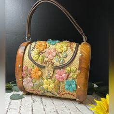 Introducing A Truly Unique And Treasured Piece: An Authentic Purse Adorned With Genuine Teakwood From Hawaii, Dating Back To The 1960s. This Exquisite Accessory Isn't Just A Fashion Statement; It's A Vessel Of Cherished Memories From My Mother's Senior Trip To Hawaii. Handcrafted With Precision And Care, Each Teakwood Detail Tells A Story Of Adventure, Exploration, And The Beauty Of Hawaiian Craftsmanship. Whether It's The Scent Of The Islands That Lingers Faintly Within Its Fibers Or The Gentle 60s Purse, Trip To Hawaii, Senior Trip, Family Legacy, Vintage Hawaiian, Vintage Purse, Piece Of Me, Close To My Heart, Cherished Memories