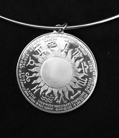 This is a sterling silver Scorpio Zodiac coin pendant. It contains .835 oz. of silver, The obverse features Scorpio and the reverse features all 12 constellation zodiac signs. It has been encased to allow wearing as a pendant on the SS marked wire choker. It is hard to photograph but SS marking is on the hook of the fastener. Simple hook and chain eye closure which allows about 1" adjustment in size 15" to 16" neck size. It appears in excellent condition.  Nice piece for any Scorpio -- October 24 thru November 22 Celestial Silver Coin Pendant Jewelry, Silver Zodiac Sign Medallion Jewelry, Silver Zodiac Sign Amulet Jewelry, Round Zodiac Sign Jewelry Collectible, Symbolic Zodiac Sign Collectible Jewelry, Symbolic Zodiac Sign Jewelry, Collectible Round Zodiac Sign Jewelry, Constellation Zodiac Signs, Wire Choker Necklace