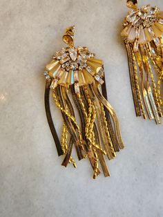 Gold tones earring, with CZs & peach colored crystals on a post - length 3" Glamorous Crystal Earrings With Sparkling Stones, Jeweled Chandelier Drop Earrings, Glamorous Rhinestone Earrings, Glamorous Gold Tassel Earrings For Wedding, Gold Jeweled Beaded Drop Earrings, Crystal Earrings With Sparkling Stones, Evening Crystal Embellished Dangle Earrings, Glamorous Dangle Chandelier Earrings, Glamorous Jeweled Crystal Earrings