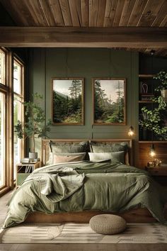 a bedroom with green walls and pictures on the wall above the bed in front of it