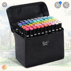 a black case filled with lots of colorful crayons