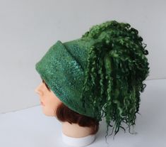 Felted hat, Green wool hat, Felt winter warm hat, Curly free Wool Hat Unisex, Warm felt hat This felted hat was made of soft merino wool and wool locks  through a wet felting process.  Felt hat is decorated with , wool locks  You can make folds and wearing a hat on the different ways. Felted hat is warm and perfect for cold weather.   Head circumference 58-59 cm (22,5''-23'') Full height caps without locks  23 см (9.1 in) The scarf for the set https://www.etsy.com/listing/739219323/felt-fur-curly-scarf-rustic-green-hand Easy care. Hand wash in soap water. Rinse, let it dry. Steam iron. Thanks, for visiting my shop Ready to ship Felted Hat, Hat Wool, Green Hand, Wool Winter, Wearing A Hat, Steam Iron, Green Wool, Wet Felting, Felt Hat