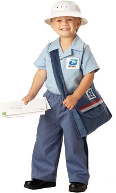 a young boy wearing overalls and a hard hat