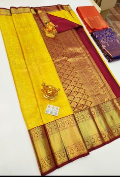 "The saree is made of pure silk kanjeevaram/kanchipattu with gold zari, Pallu, and blouse. Various Colours Available, please see photos. Mention desired colour in \"Optional Note\" when purchasing saree. ❗️❗️❗️PLEASE CONTACT SELLER TO CONFIRM COLOUR COMBINATION FOR AVAILABILITY ️❗️❗️ Upon request: Tussels, fall and pico and blouse work (Aari work and Maggam work) will be done with extra charges  Excellent quality with beautiful colours and combinations." Gold Saree With Traditional Patterns In Tissue Silk, Gold Saree With Tilla For Navratri, Ceremonial Gold Tussar Silk Traditional Wear, Diwali Puja Temple Jewelry Saree, Gold Paithani Silk Dupatta For Puja, Gold Art Silk Dupatta With Tilla, Ceremonial Gold Tussar Silk Dupatta, Yellow Tissue Silk Traditional Wear For Puja, Gold Paithani Silk Saree For Festivals