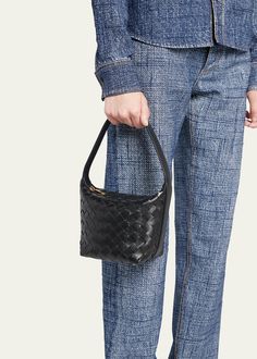 "Find BOTTEGA VENETA Candy Wallace Top Handle Bag on Editorialist. The Bottega Veneta Candy Wallace bag is crafted from intrecciato leather. It features an adjustable top handle that can be worn as a top handle or a shoulder strap. The bag has a zip top closure and measures approximately 6.7\"H x 5.3\"W x 4.5\"D. It is made in Italy." Evening Woven Leather Handheld Bag, Evening Shoulder Bag With Double Handle In Woven Leather, Evening Shoulder Bag With Double Handle And Woven Leather, Evening Double Handle Woven Leather Shoulder Bag, Evening Hobo Bag With Intrecciato Weave, Evening Bucket Bag With Intrecciato Weave, Elegant Woven Leather Evening Bucket Bag, Elegant Woven Leather Bucket Bag For Evening, Designer Woven Leather Hobo Bag For Evening