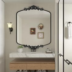 a bathroom with a large mirror above the sink