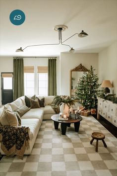 Soft cream checkered rug in living room with white sectional couch decorated with green throw pillows and blankets. Christmas tree is in the corner of room. Dark wood round coffee table with lit candle sticks Neutral Holiday Decor, Rugs Washable, Stone Rug, Checkered Rug, Selling Furniture, Classic Rugs, Room Aesthetic, Unique Furniture, Living Room Inspiration